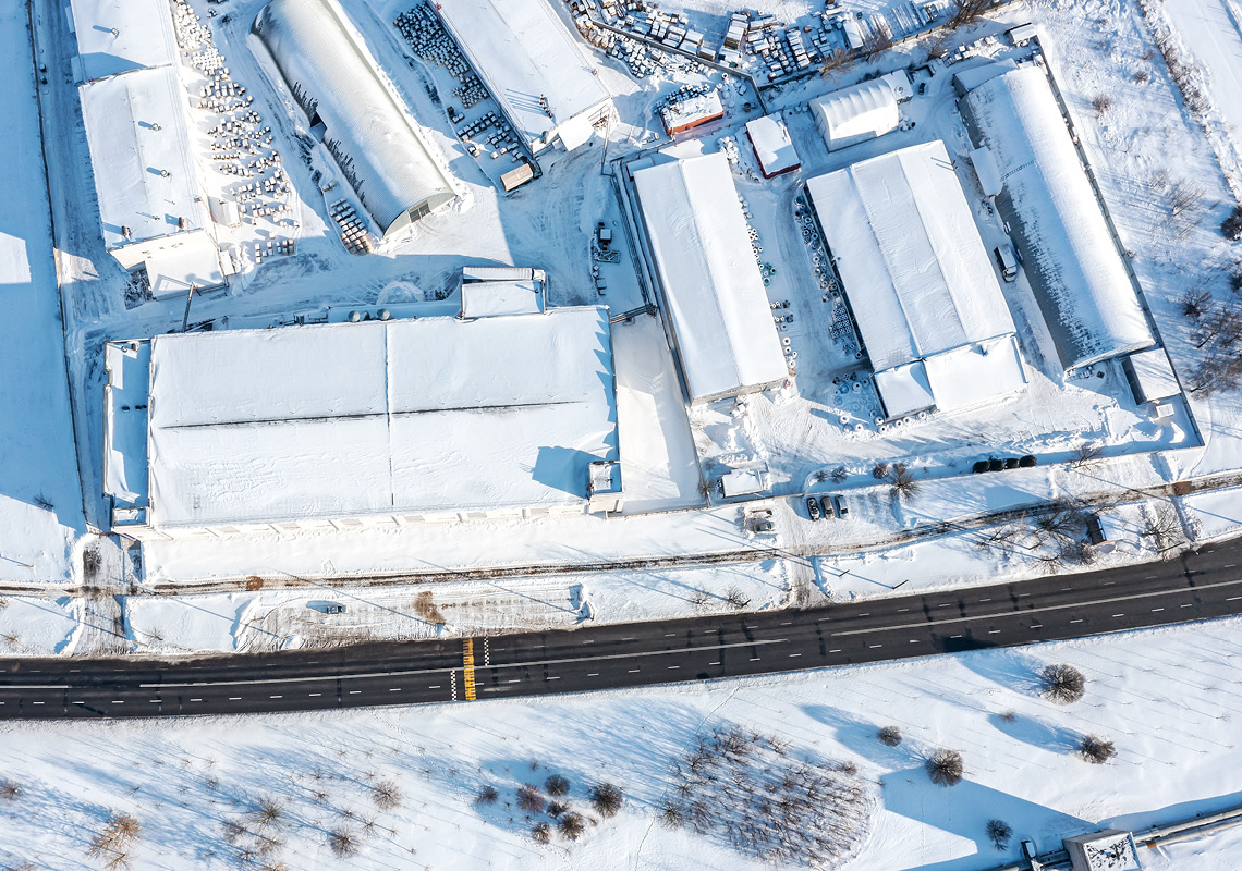 Aerial view of snow covered warehouses